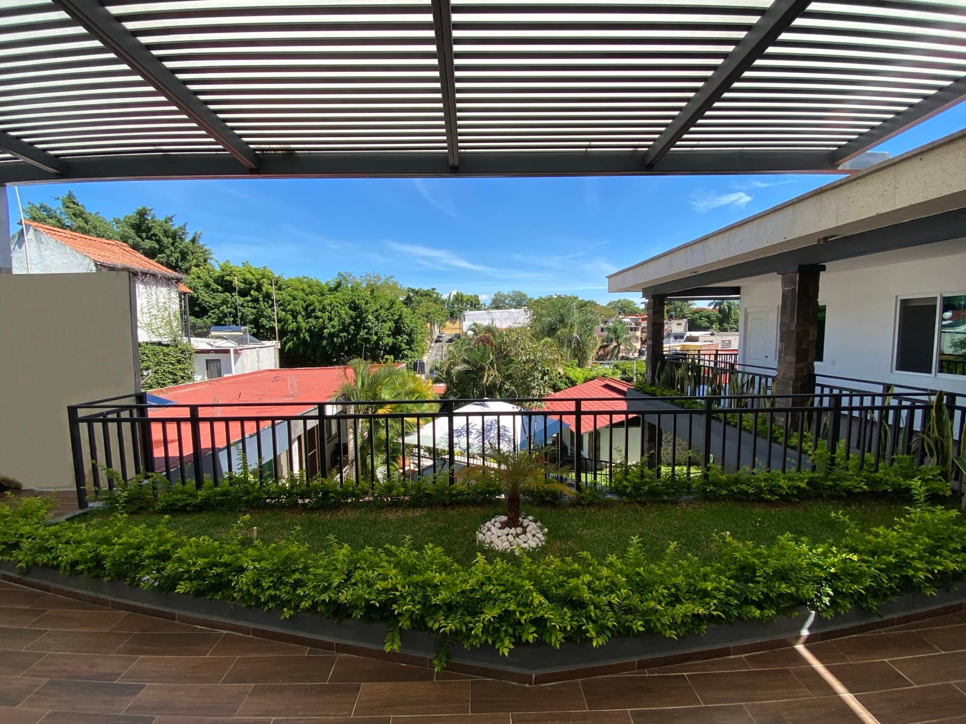 Terrace overlooking the garden and pool